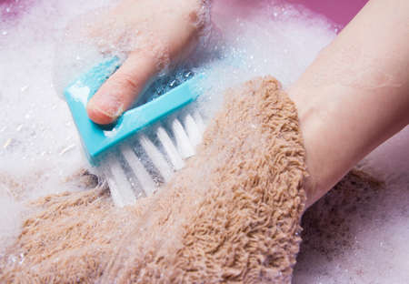 Woman washing towelの写真素材