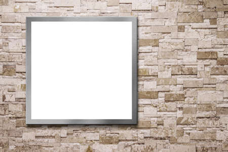 Blank billboard on the stone wallの写真素材