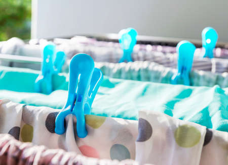 Clothes pegs on a clothes lineの写真素材