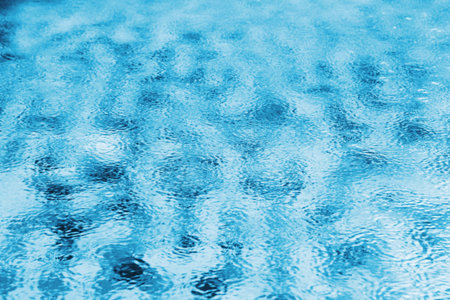 Abstract blur background of swimming pool in rainy dayの写真素材