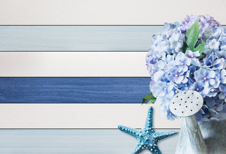Hydrangea flowers in zinc watering can on wooden background for summerの写真素材