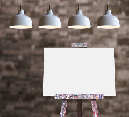 Wooden easel with blank painting canvas in the roomの写真素材