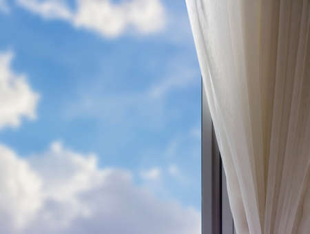 Airy curtain at window in the bedroomの写真素材