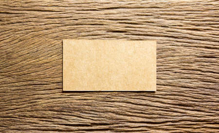 Brown paper on wooden backgroundの写真素材