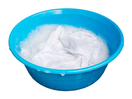 Soak whites clothes in the enamelled bowlの写真素材