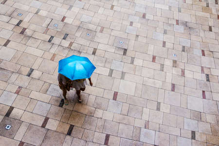 people with umbrella in rainy dayの写真素材