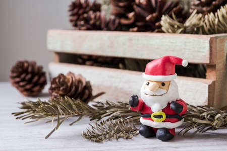 Christmas decoration of santa claus and pine conesの写真素材