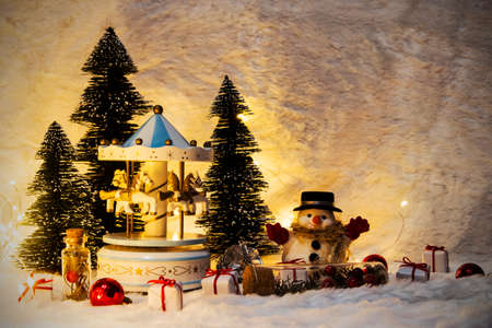 Chistmas decoration of carousel horse and pine coneの写真素材