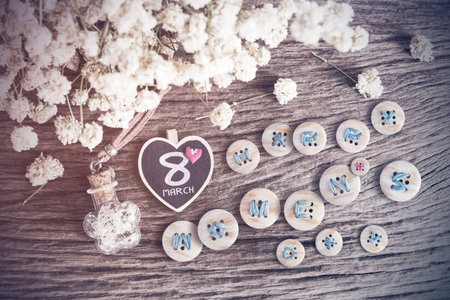 Happy womens day and dry flowers on old woodenの写真素材