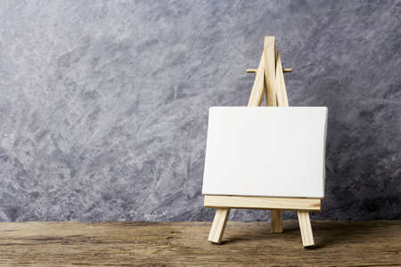 Blank canvas frame on easel paintingの写真素材