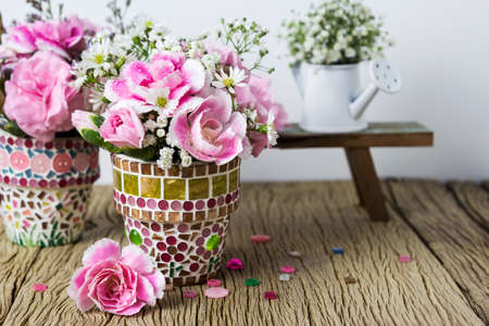 Pink carnation in mosaic flower potの写真素材