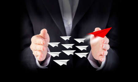 Leadership concept of business woman hand with paper planesの写真素材