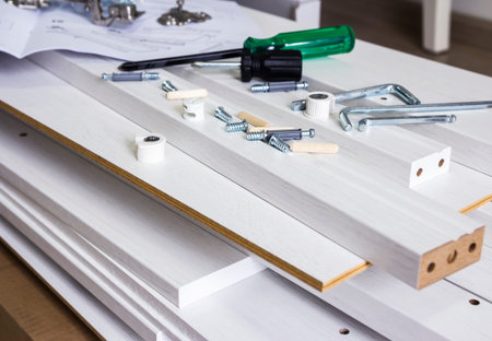 Furniture assembly concept of tool and white wood