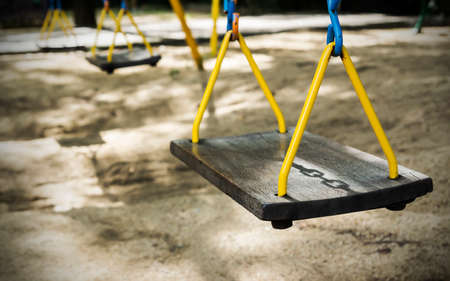 Swing with shadow chain in the playgroundの写真素材