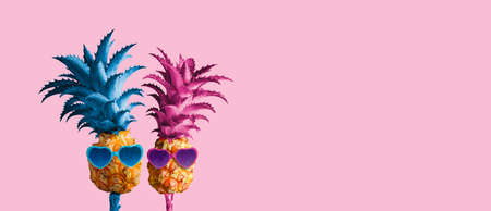 Couple pineapples on pink background minimal summer love conceptの写真素材