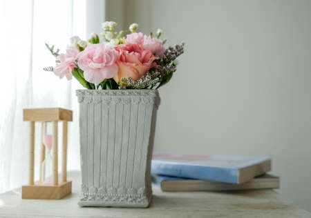 Carnation flower in cement pot on vintage cabinet at the bedroomの写真素材