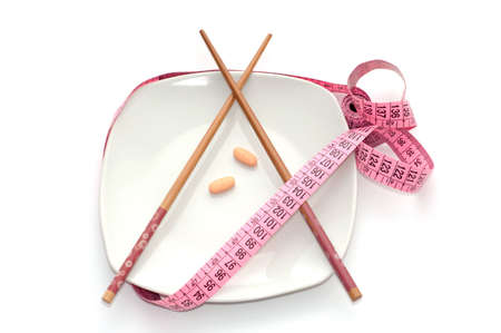 Plate with pills isolated on whiteの写真素材