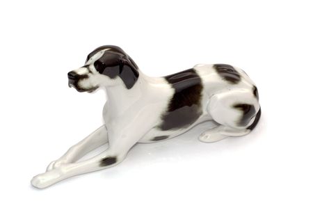 Porcelain antique dog isolated on whiteの写真素材