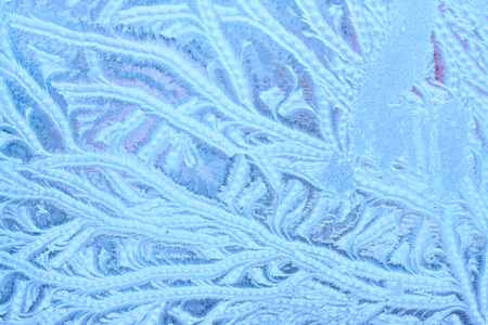 Icy patterns on glass. Winter background with frosty textureの写真素材
