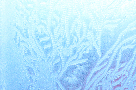 Ice patterns on winter glassの写真素材