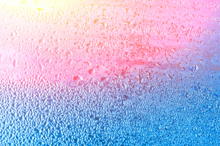 Wet window with condensation on the glass. Natural background with high humidityの写真素材