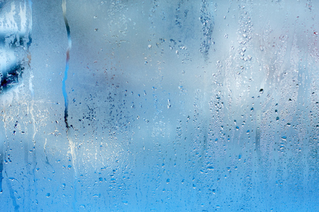 Natural water steam on glass. Blue drop textureの写真素材