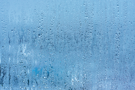 Drops water on the clear glass backgroundの写真素材