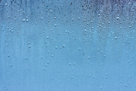Drops water on the clear glass backgroundの写真素材