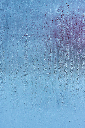 Drops water on the clear glass backgroundの写真素材