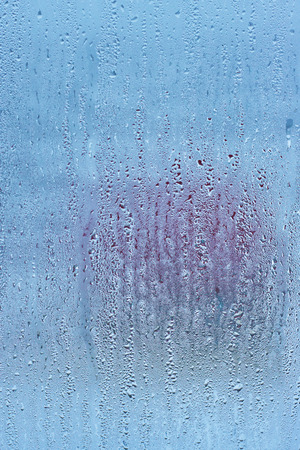 Drops water on the clear glass backgroundの写真素材