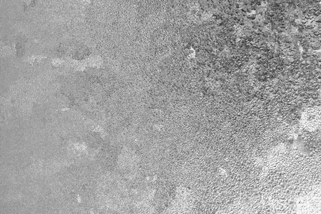 Black and white ice patterns on the glass. Monochrome winter background with a frosty textureの写真素材