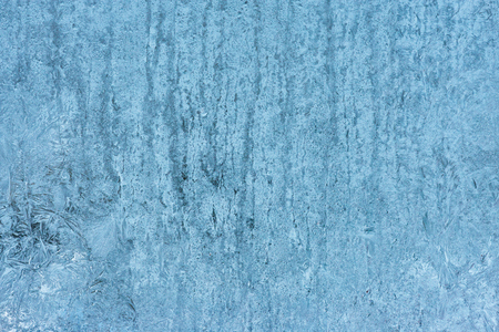 Frozen glass, ice texture on window, natural backgroundの写真素材