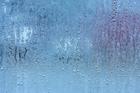 Drops water on the clear glass backgroundの写真素材