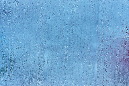 Natural blue water drop background on glassの写真素材