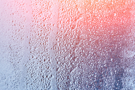 Frozen glass, ice texture on window, natural backgroundの写真素材