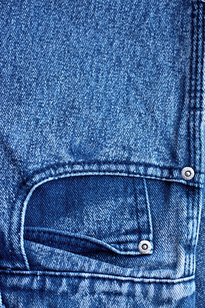 Blue jeans closeup view to abstract space of empty natural clean denim texture for traditional business background in cold bright colorsの写真素材