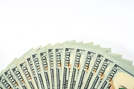 Pile of one hundred dollar banknotes as money background. New dollar bills spread in financial concept.の写真素材