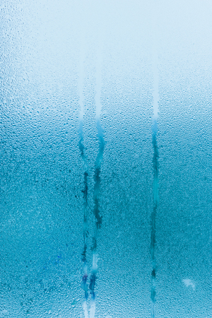 Water condensation on window during winter. Strong humidityの写真素材