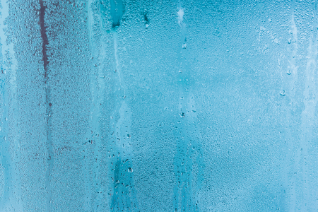 Closeup water condensation on window glass backgroundの写真素材