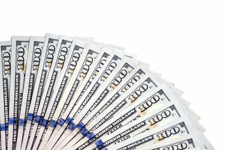 Pile of one hundred dollar banknotes as money background. New dollar bills spread in financial concept.の写真素材