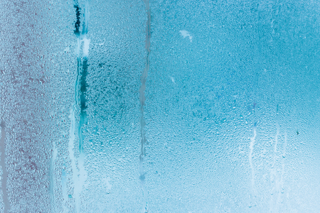 Closeup water condensation on window glass backgroundの写真素材