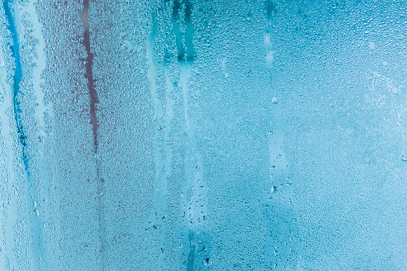 Closeup water condensation on window glass backgroundの写真素材