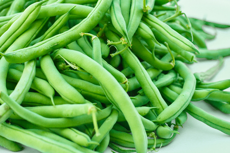 Pile of green beans, photographed on blurred background, natural fresh productの写真素材