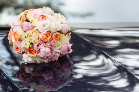 Wedding beautiful bridal bouquet of natural flowers, closeup with blurred backgroundの写真素材