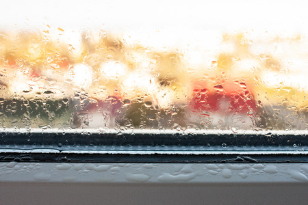 Background photo of increased condensation on the glass, water droplets on the windows, horizontal view, high quality and detailの写真素材