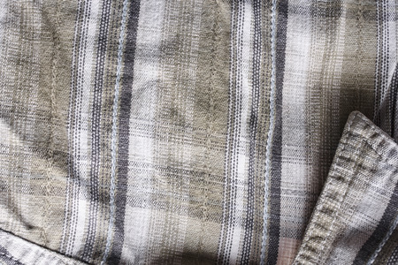 Close up part of a shirt from hemp fabric. Casual man's shirt with pattern. Wrinkled texture from hemp and cotton backgroundの写真素材