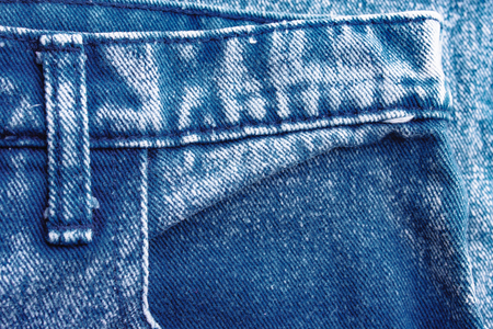 Background jeans, blue denim texture fabric with a seam of fashionable design. Empty pattern copy spaceの写真素材