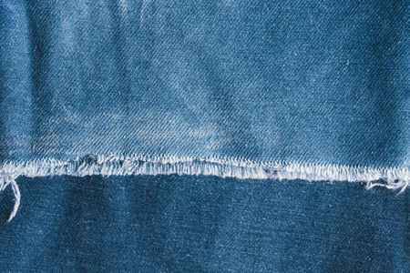 Background jeans, blue denim texture fabric with a seam of fashionable design. Empty pattern copy spaceの写真素材