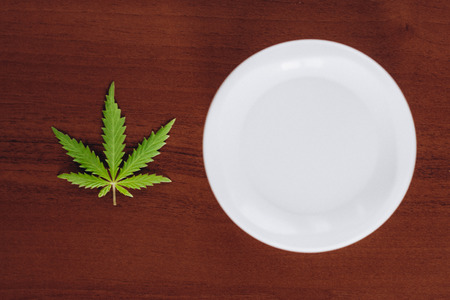 Detail of cannabis hemp cream with marijuana leaf - cannabis topicals concept. Cream from biological and ecological plants of hemp vegetable pharmaceutical oil CBDの写真素材