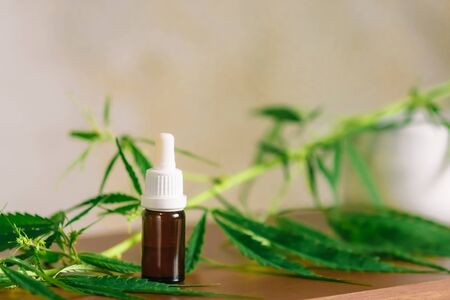 Bottle of CBD cannabis oil. Health marijuana with cannabidiol content. Pharmaceutical hemp drug preparation with safe cannabinoidsの写真素材